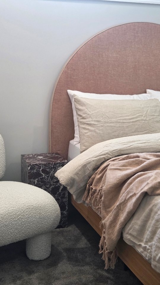 What a beautiful way to end the year 🩷

A guest bedroom that does more than look good.
Layered neutrals, textured fabrics and sculptural curves ground the space while a statement artwork by Lottie Rae and that incredible Rosa Levanto marble side table bring the luxury. Calm, functional, beautiful and effortlessly inviting.