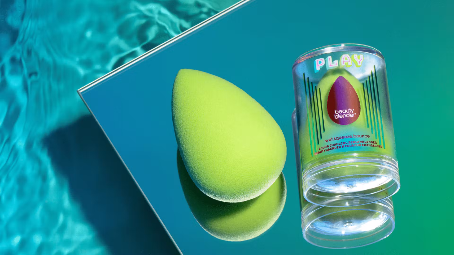 A green blender from Beauty Blender is shown just above what we can assume is a swimming pool.